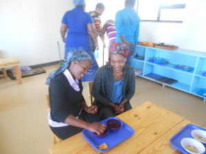 Thoko presenting sponging to Nokuthula